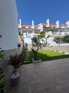 a courtyard of a building with a building at Chalet Sanxenxo Miraflores in Sanxenxo
