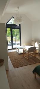 a living room with a couch and a table at Łagowski Reset in Łagów