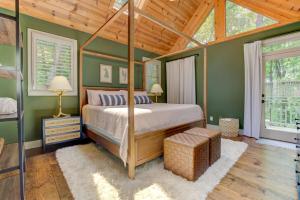 a bedroom with a canopy bed and a wooden ceiling at Hot Tub Soaks Starlit Smores Fireside Reads Nearby Golf Pools Trails - Wandering Creek in Dawsonville +66 photos