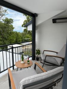 a balcony with a couch and chairs and a table at Apartment Maja in Dobrinj +24 photos