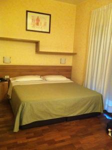 A bed or beds in a room at Residence Desenzano