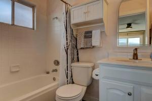 a white bathroom with a toilet and a sink at Special Rates-Skyline Escape-Reno-UNR-Tahoe in Reno +29 photos