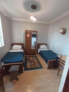 Postel nebo postele na pokoji v ubytování Rose House