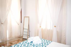 Un ou plusieurs lits dans un hébergement de l'établissement Miro B&B