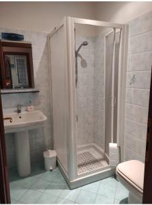 a bathroom with a shower and a sink at Apartment by the sea in Ventimiglia