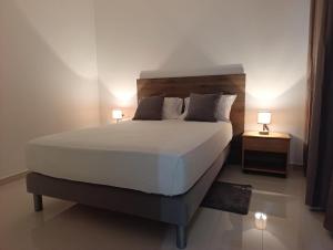 Postel nebo postele na pokoji v ubytování Elly Apartamentos2