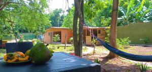 a hammock on a table in a garden with a house at Mystic Moment in Negril