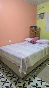 a bedroom with a large bed in a room at Apto C com cozinha em Macapá in Macapá +12 photos