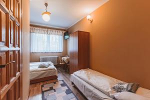 Posteľ alebo postele v izbe v ubytovaní Pokoje Gościnne U Babci