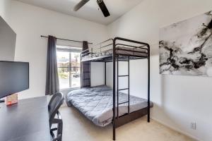 a bedroom with a bunk bed and a desk at 7 Mi to Dtwn Palm Springs Family Home with Pool in Cathedral City +19 photos