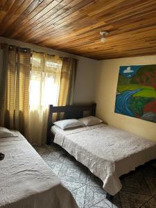 Postel nebo postele na pokoji v ubytování Monteverde Monkey Hostel