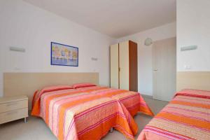 Ένα ή περισσότερα κρεβάτια σε δωμάτιο στο Apartments in Lignano 21707