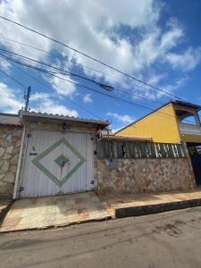 a building with a door with a painting on it at República Minas Novas in Ouro Preto