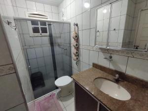 a bathroom with a sink and a toilet and a mirror at República Minas Novas in Ouro Preto +7 photos