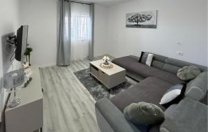 a living room with a couch and a table at Gorgeous Apartment In Kastel Stari in Kastel Stari
