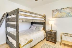 a bedroom with a bunk bed and a desk at 9 Mi to Joshua Tree NP Yucca Valley Home with Pool in Yucca Valley +18 photos