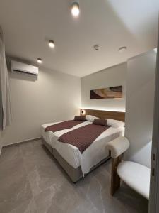 En eller flere senge i et værelse på Costa Blu mare