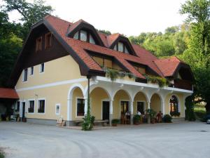 a large house with a red roof at Turisticna Kmetija Pudvoi in Bizeljsko