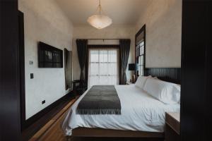 Postel nebo postele na pokoji v ubytování Surf Hotel & Chateau