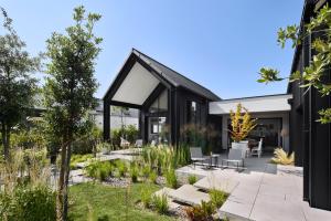 a modern house with a black roof at Les Villas Majolie - Villa 13 Océan - 5 étoiles in Combrit