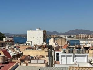a view of a city with buildings and the water at Apartamento moderno centro Aguilas 150m playa in Águilas