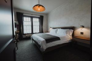 Postel nebo postele na pokoji v ubytování Surf Hotel & Chateau
