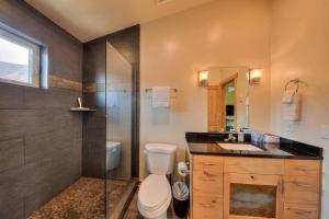 a bathroom with a toilet and a shower and a sink at Stylish Casita Moab 2 - In Town, Outdoor Sauna in Moab +40 photos