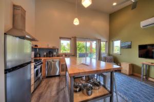 a large kitchen with a large island in a room at Stylish Casita Moab 2 - In Town, Outdoor Sauna in Moab
