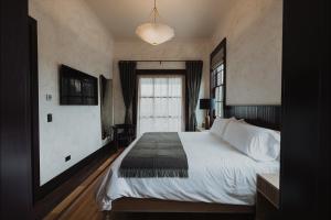 Postel nebo postele na pokoji v ubytování Surf Hotel & Chateau