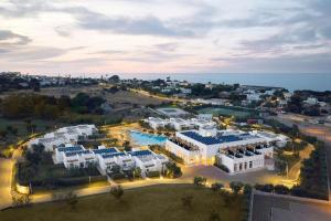 an aerial view of a resort with a pool at Cala Ponte, a Tribute Portfolio Hotel in Polignano a Mare