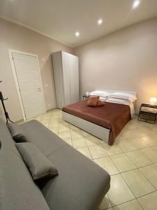 Postel nebo postele na pokoji v ubytování Donna Teresa Casa Vacanze