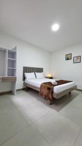 Voodi või voodid majutusasutuse Hotel Fuente Real Popayán toas
