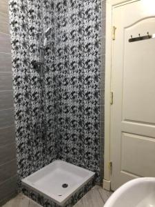 a shower with a white sink in a bathroom at العالمين in El Alamein +11 photos