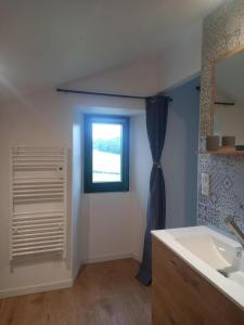 a bathroom with a sink and a window at Selaurua in Sare +13 photos