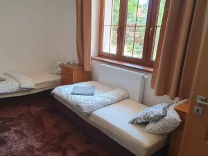 Postel nebo postele na pokoji v ubytování Statek U Šimla