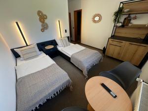 Postel nebo postele na pokoji v ubytování Aparthotel Zur Linde - by Willms & Schömer eG