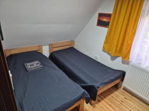 Postel nebo postele na pokoji v ubytování Stašina vikendica Divčibare