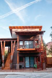 a house with a staircase on the side of it at Casa Moab 4 - In Town - Outdoor Sauna! in Moab