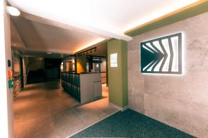 Kuchyň nebo kuchyňský kout v ubytování Hôtel L'Echappée Vosgienne - SPA et Sport à 300m du lac