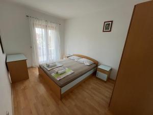 Posteľ alebo postele v izbe v ubytovaní Apartments Dada
