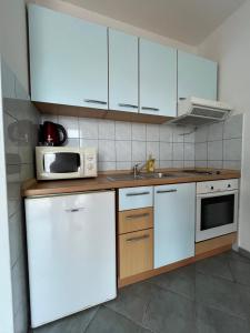 Kuchyňa alebo kuchynka v ubytovaní Apartments Dada