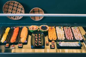a display of different types of food on a shelf at Hotel Faranda Collection Zona G in Bogotá