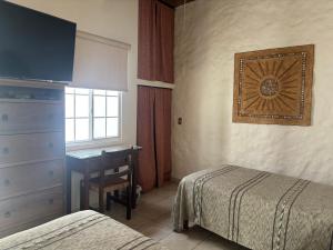 Postel nebo postele na pokoji v ubytování Quinta Don Jose Boutique Hotel