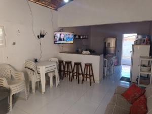 TV a/nebo společenská místnost v ubytování Aluguel por temporada em Luis Correia