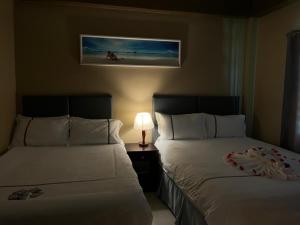 Postel nebo postele na pokoji v ubytování Enjoy Hotel