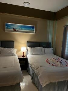 Postel nebo postele na pokoji v ubytování Enjoy Hotel