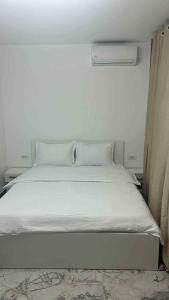 En eller flere senge i et værelse på Costinești Apartament