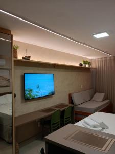 TV a/nebo společenská místnost v ubytování VILA ATLÂNTIDA 211A