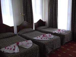 Ein Bett oder Betten in einem Zimmer der Unterkunft Antik Ridvan Hotel