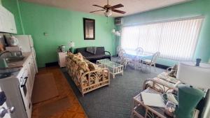 a living room with a couch and a table at Green Sea Suite at High Point North in Ocean City